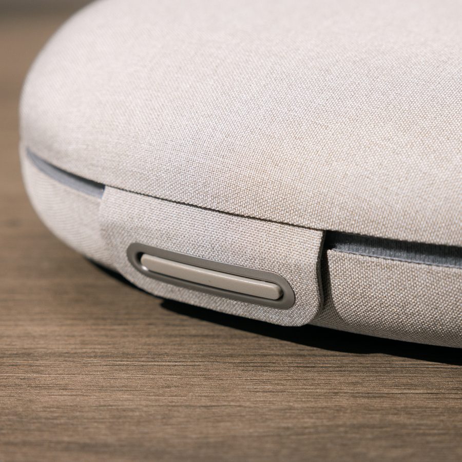 Close-up of the magnetic closure on the Sony WH-1000XM6 headphones’ compact carrying case.