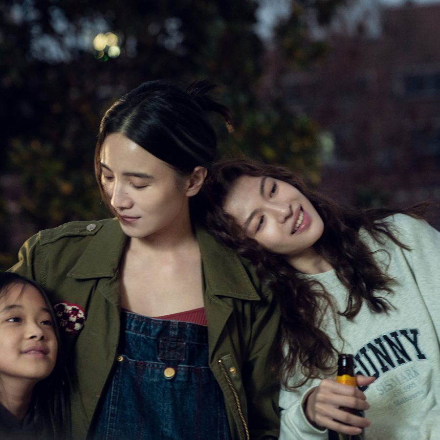 In a scene from Her Story, two women Tiemei (Song Jia) and Ye (Elaine Zhong) and Tiemei’s daughter relax outdoors in the evening. 