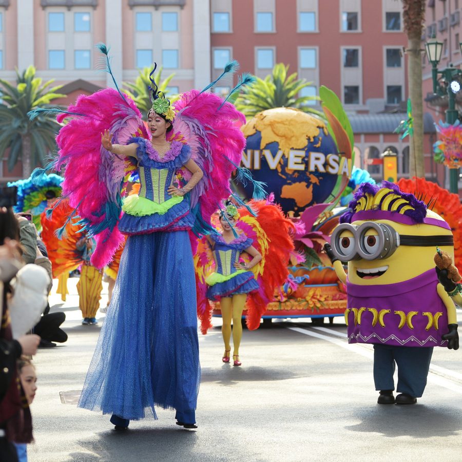 Exterior view of people watching a street parade featuring characters from the film Minions at Universal Beijing Resort.
