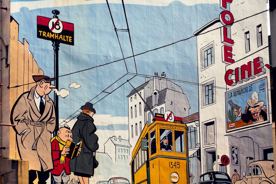 A printed cartoon drawing shows a streetscape in Brussels. 