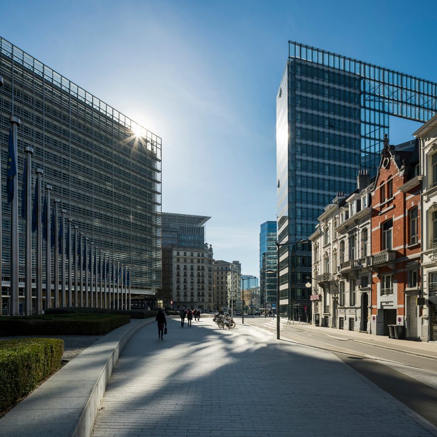 Modern buildings in Brussels glitter in the sun next to more traditional architecture. 