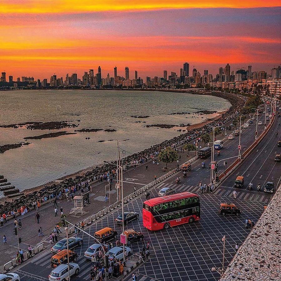 A pink and yellow sunset over Marine Drive in Mumbai.