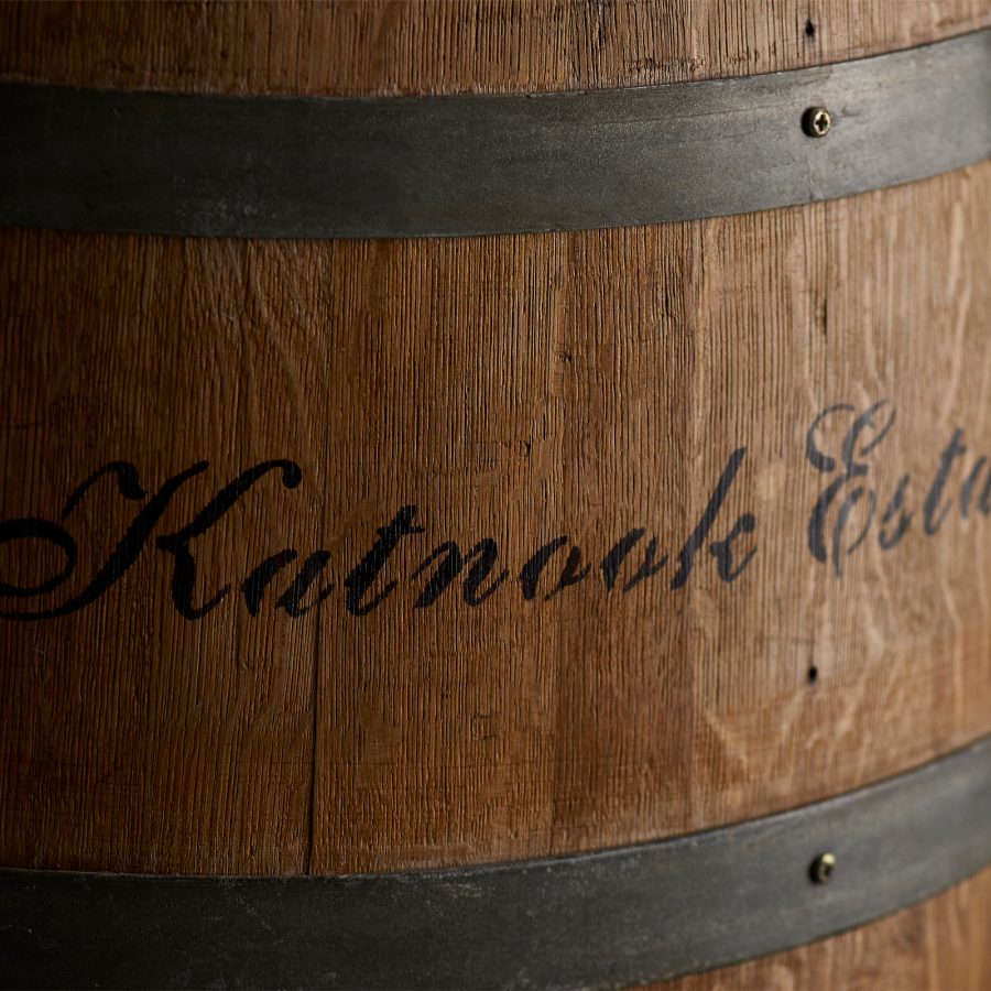 A closeup of a wine barrel with Katnook Estate branded on the facade. 