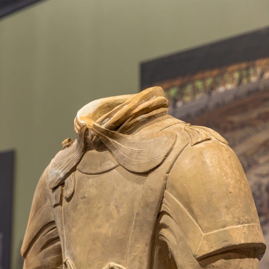 A close up of a Terracotta Warrior status shows the details carved on its collar