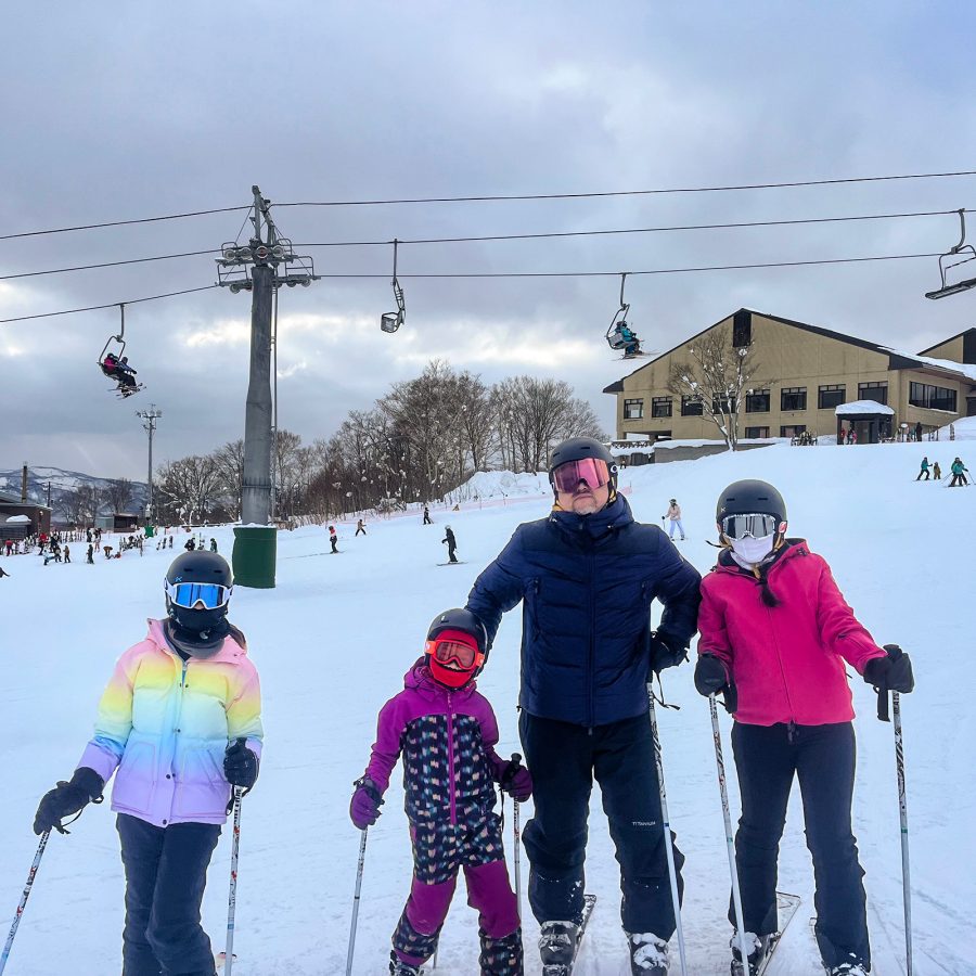 Keith Chan, his wife and his two daughters skiing.