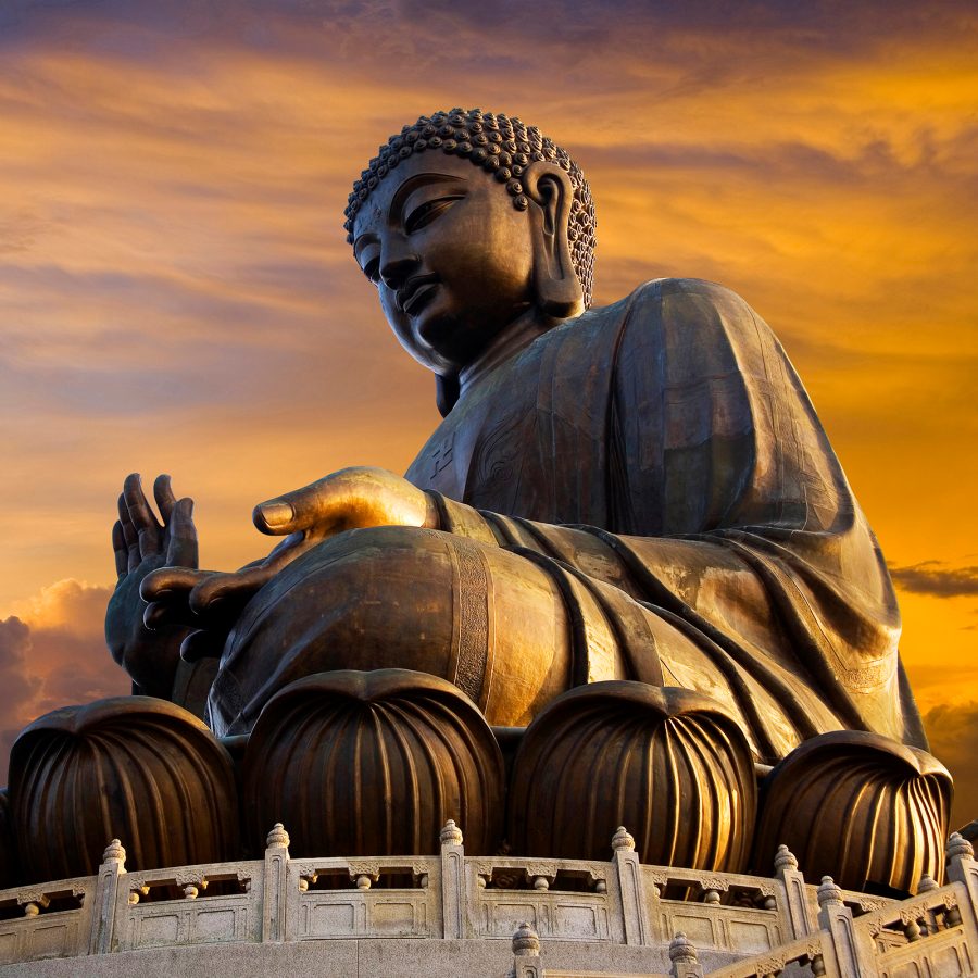 The Big Buddha appears bronze in the sunset. 