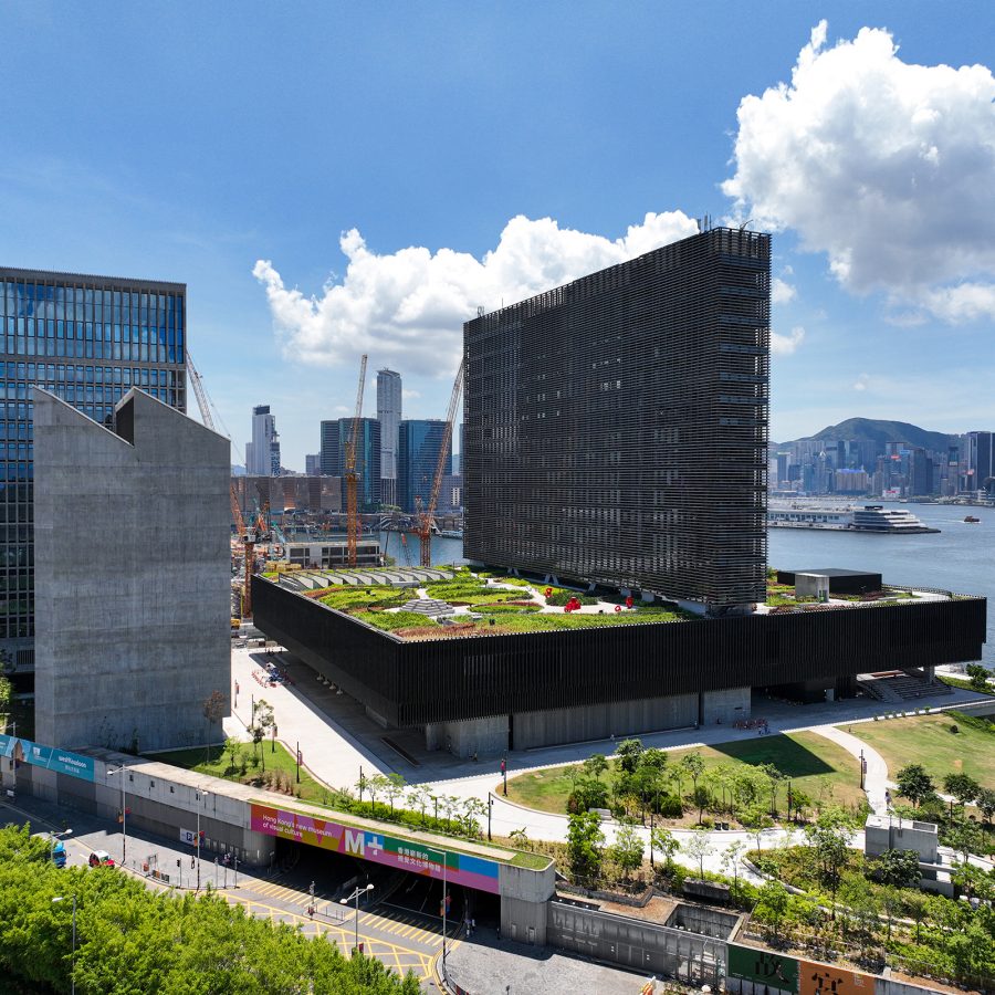 A wide shot of M+ shows the large building situated in West Kowloon Cultural District on a sunny day.