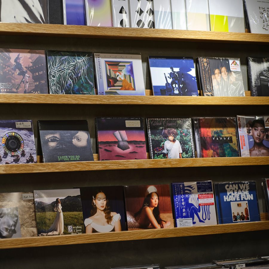 A shelf displays records on the walls. 