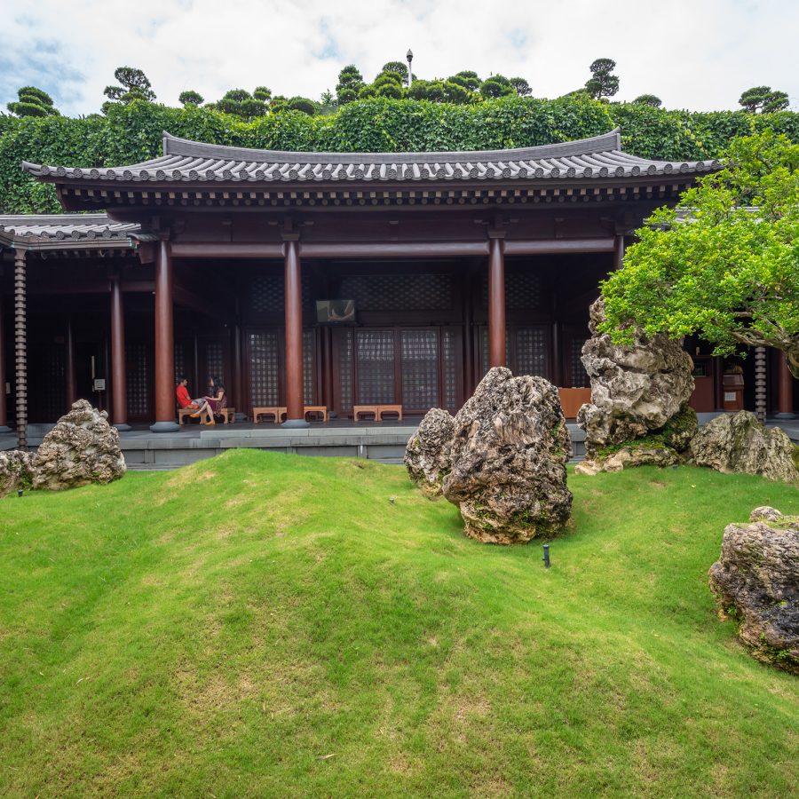 A garden is situated outside a traditional Chinese building at Chi Lin Nunnery. 