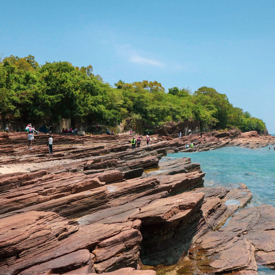 Volcanic rock formations jut out from an island at Tung Ping Chau.