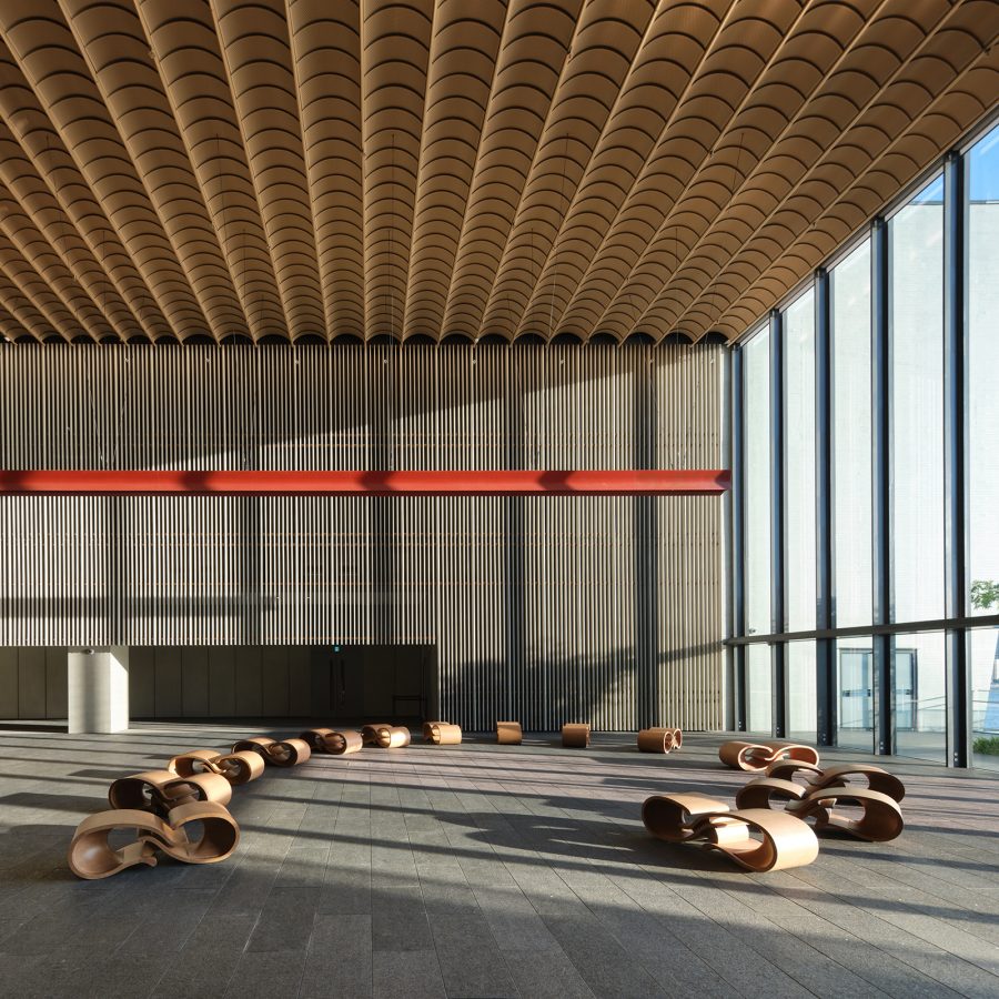A sunlit hall in the Hong Kong Palace Museum displays various works.  