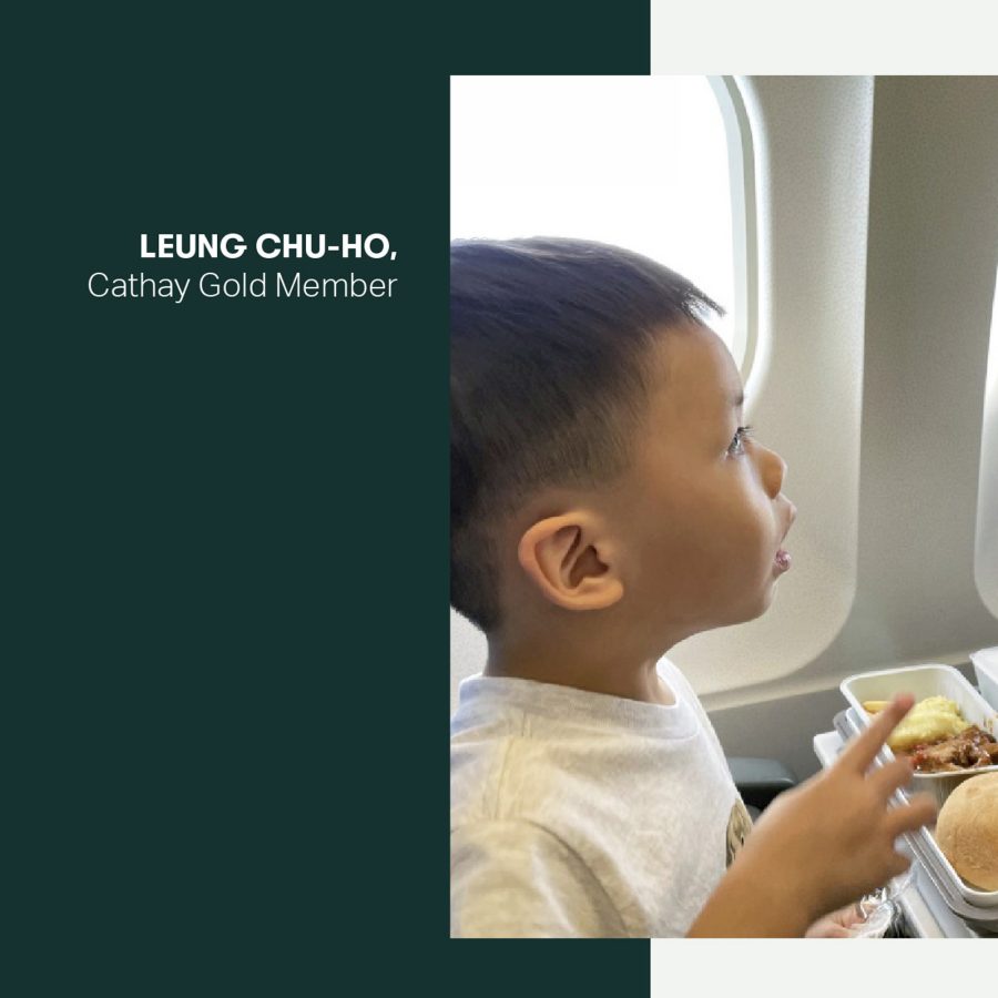 A young boy with food on a plane.