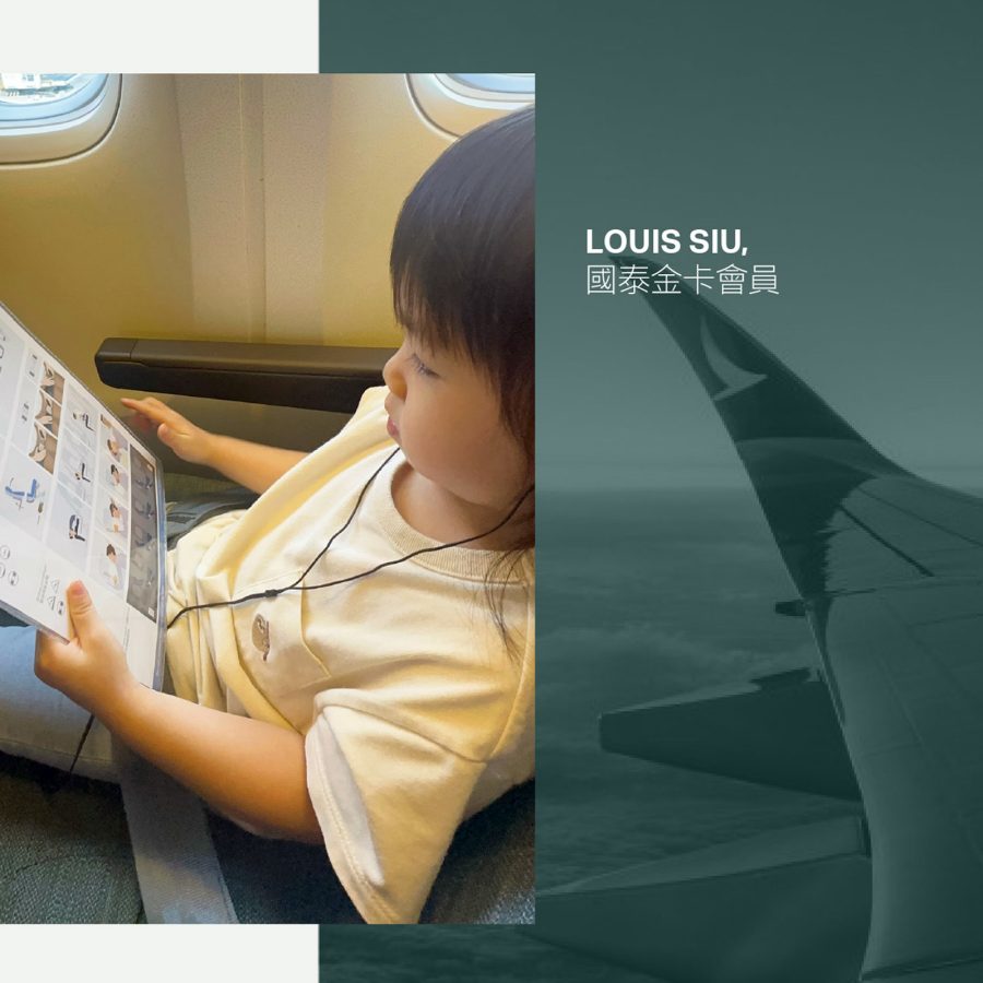 A young girl reading the safety manual on a plane.