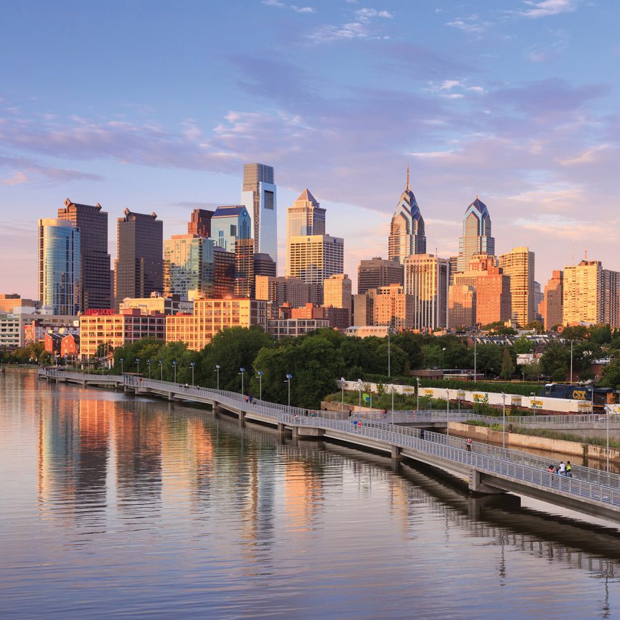 Exterior view of the Philadelphia skyline at sunset as seen from the river