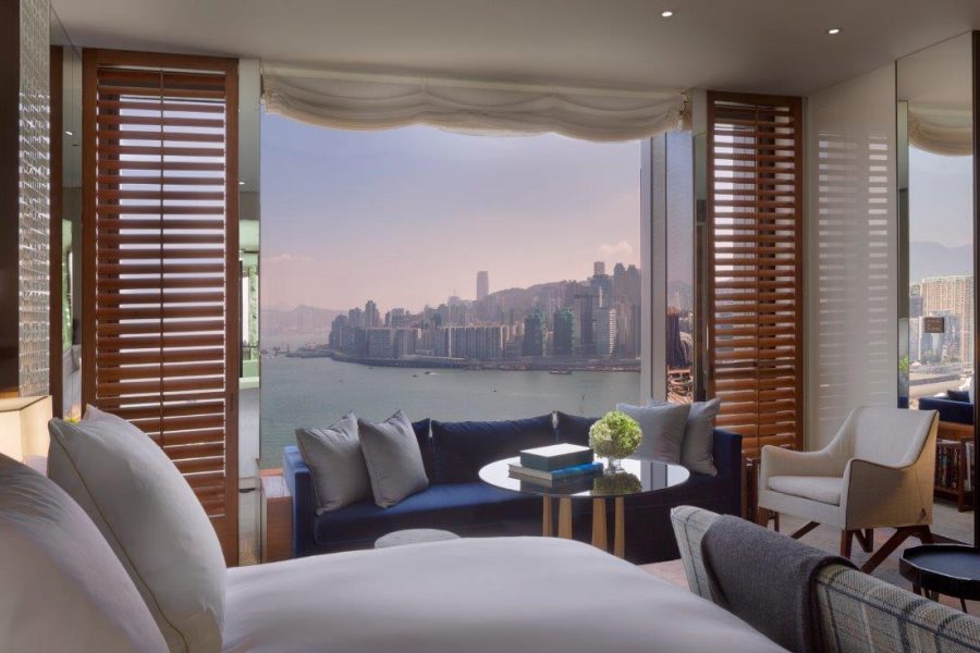 The Harbour View Room at Rosewood Hong Kong features skyline views and luxury furnishings.