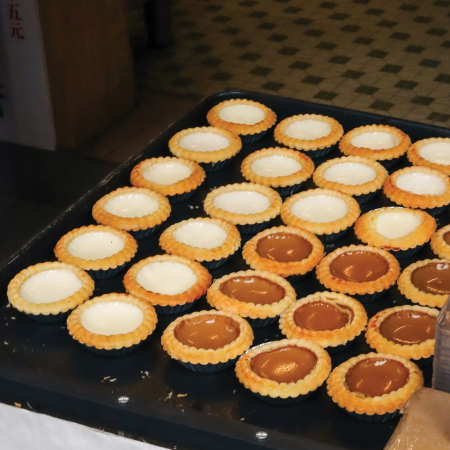 A close-up view of a tray of milk custard tarts