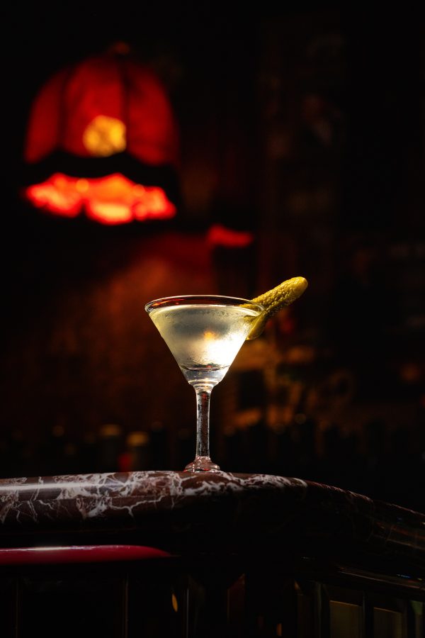 A martini topped with a cornichon sits on the bar counter at Jean-Pierrein Hong Kong.