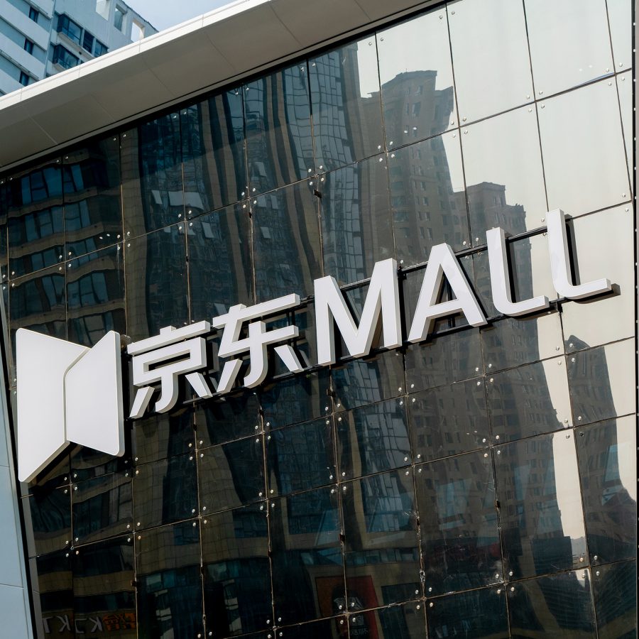 Jingdong Mall’s logo is shown hanging on its glass exterior.