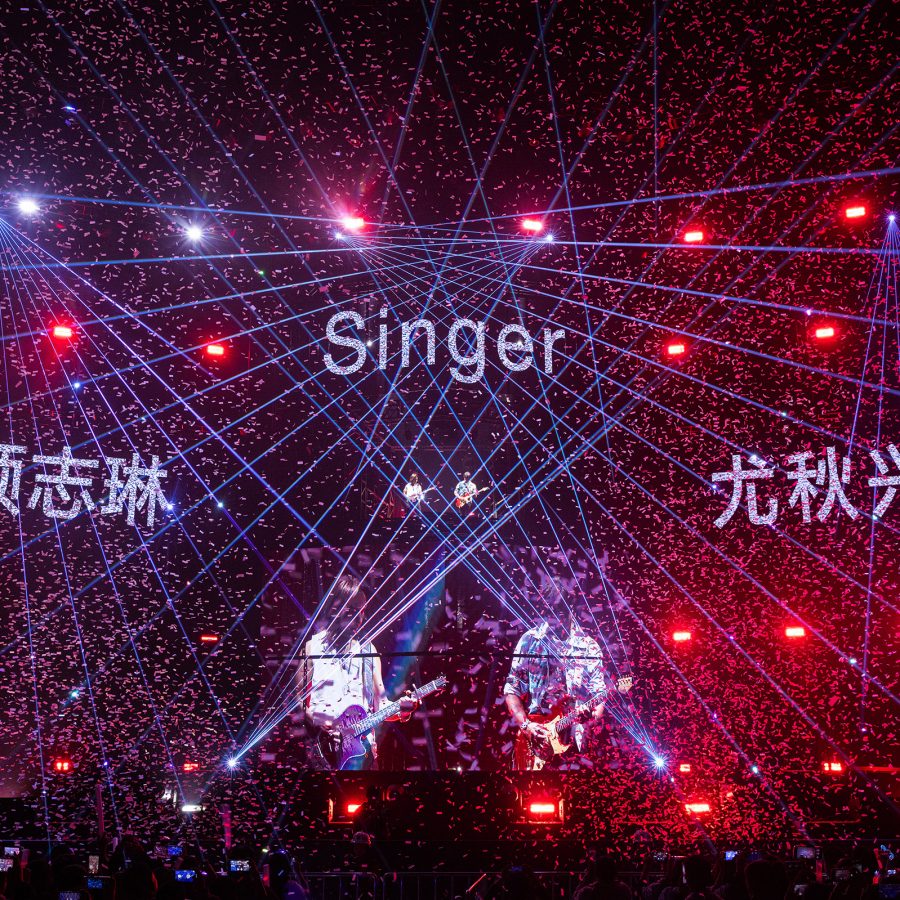 Power Station, who’ll perform in Macao in June, are shown on screen as they perform at a concert. 