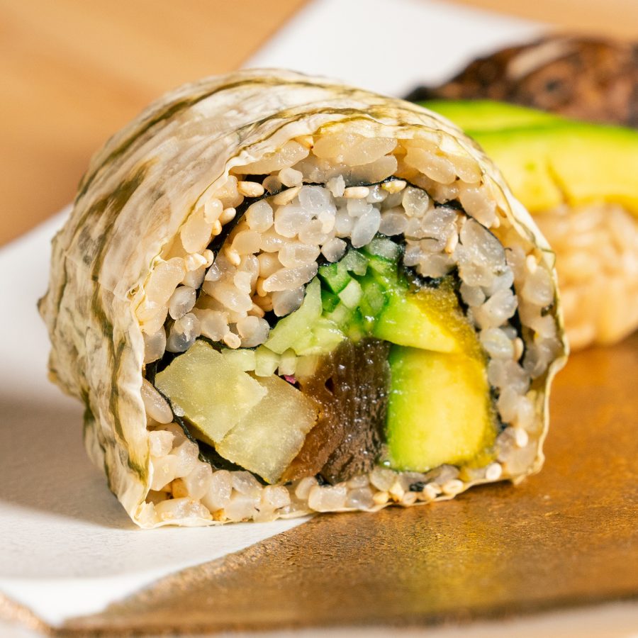 A closeup of a vegetarian futomaki with avocado served at Niwa Sushi.