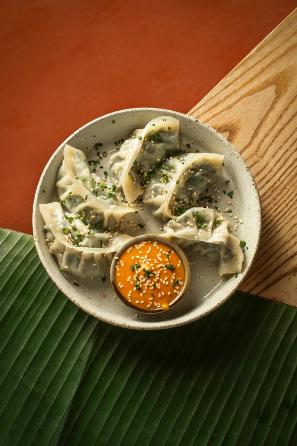 A flatlay close up of vegetarian momos served at Veda Cafe and bar.