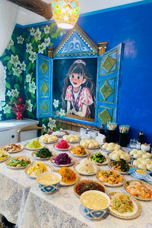 A table has been filled with colourful dishes including baozi at Mina’s Breakfast Store.   