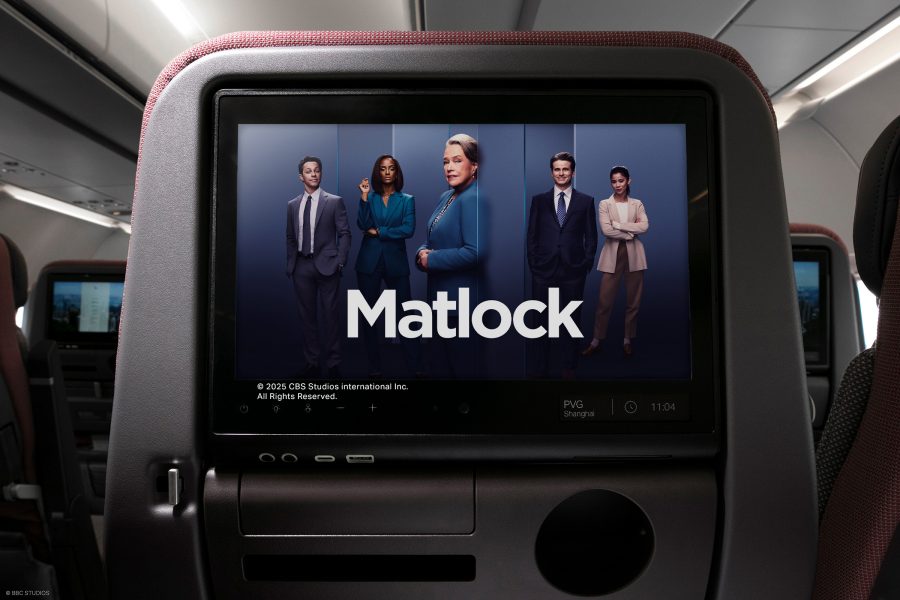 An aircraft seatback screen shows a promotional image for the TV series Matlock,  which features the words “Matlock” over an image of five men and women in professional workwear.