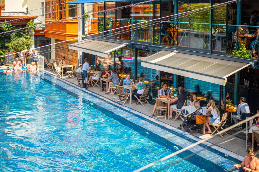 People eat and swim at The Lido in Bristol.  