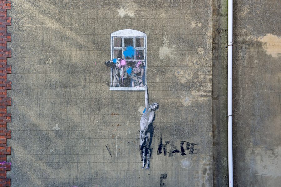 View of a Banksy street art piece in Bristol.