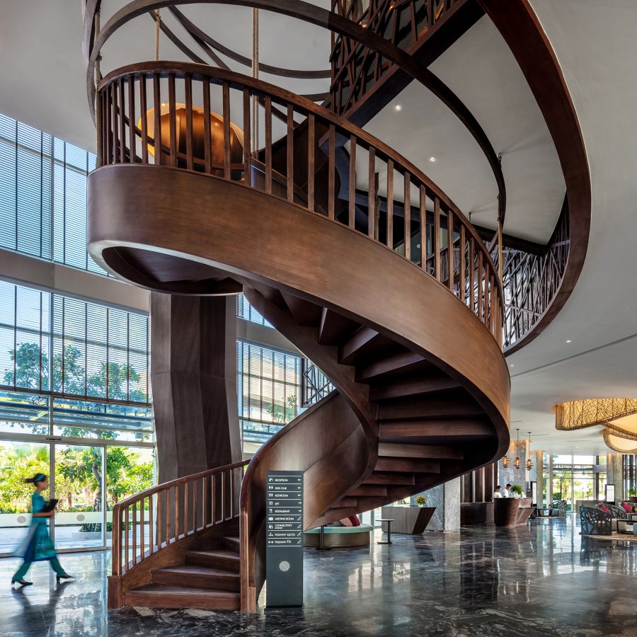 Pullman Phu Quoc Beach Resort’s lobby features a grand spiral staircase.
