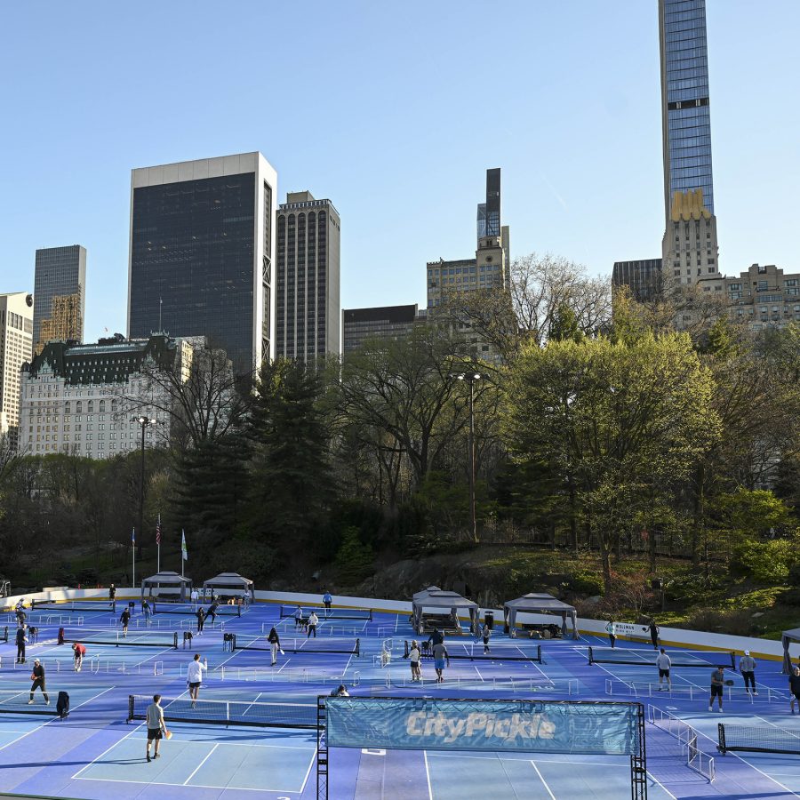 New York’s skyscrapers tower over a spread of pickleball courts in Central Park. 