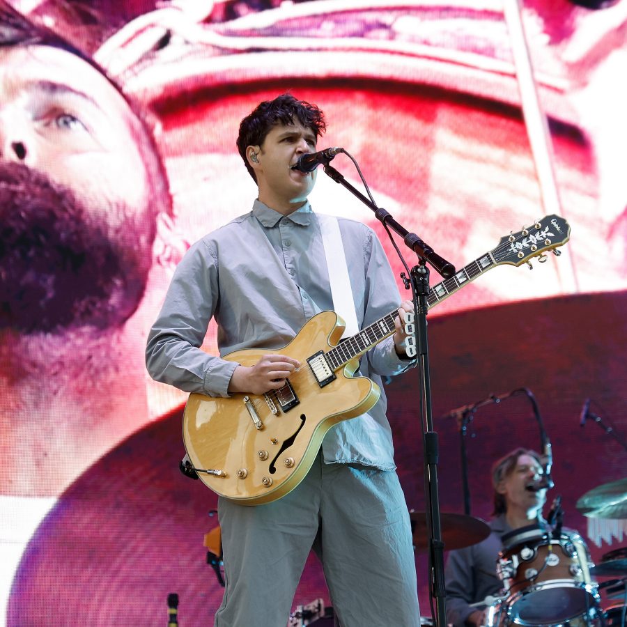 Ezra Koenig of Vampire Weekend plays guitar at the Boston Calling Music Festival.