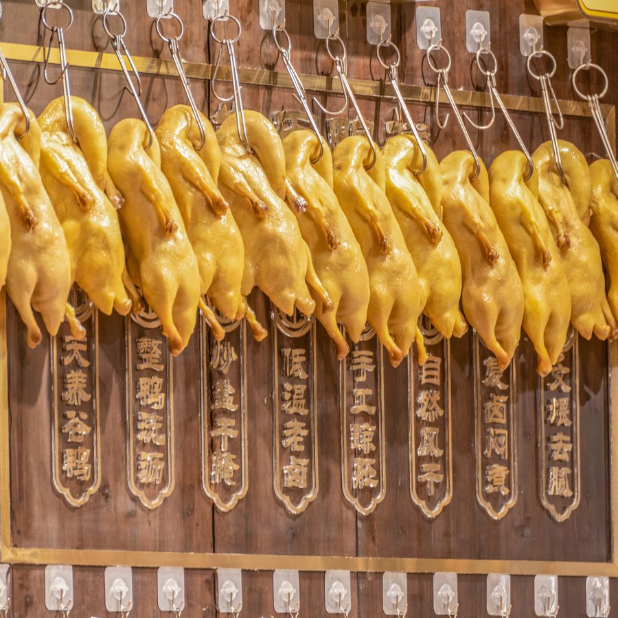 A row of roast ducks at a storefront in Nanjing.