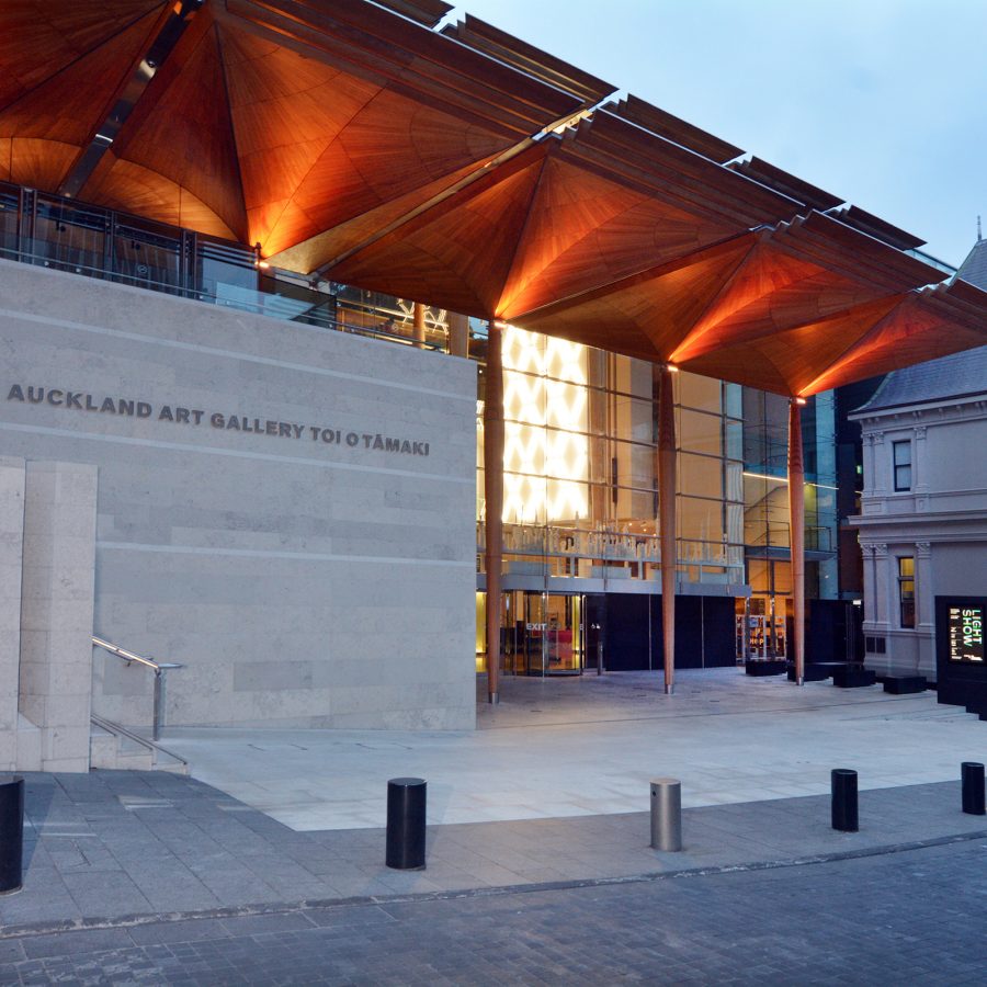 Exterior view at dusk of the Auckland Art Gallery Toi o Tāmaki.