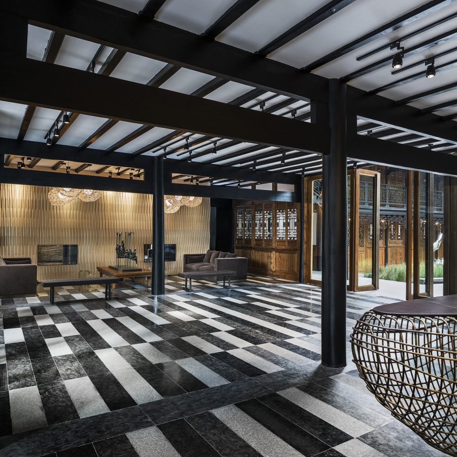 Black and white tiles dominate the reception area of The Temple House in Chengdu.