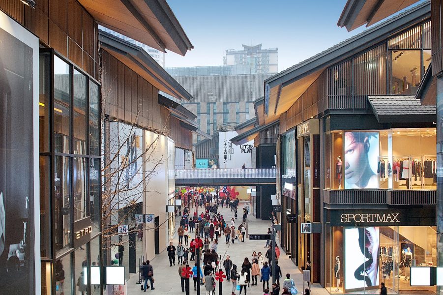 People walking in open-plan shopping village Taikoo Li in Chengdu.