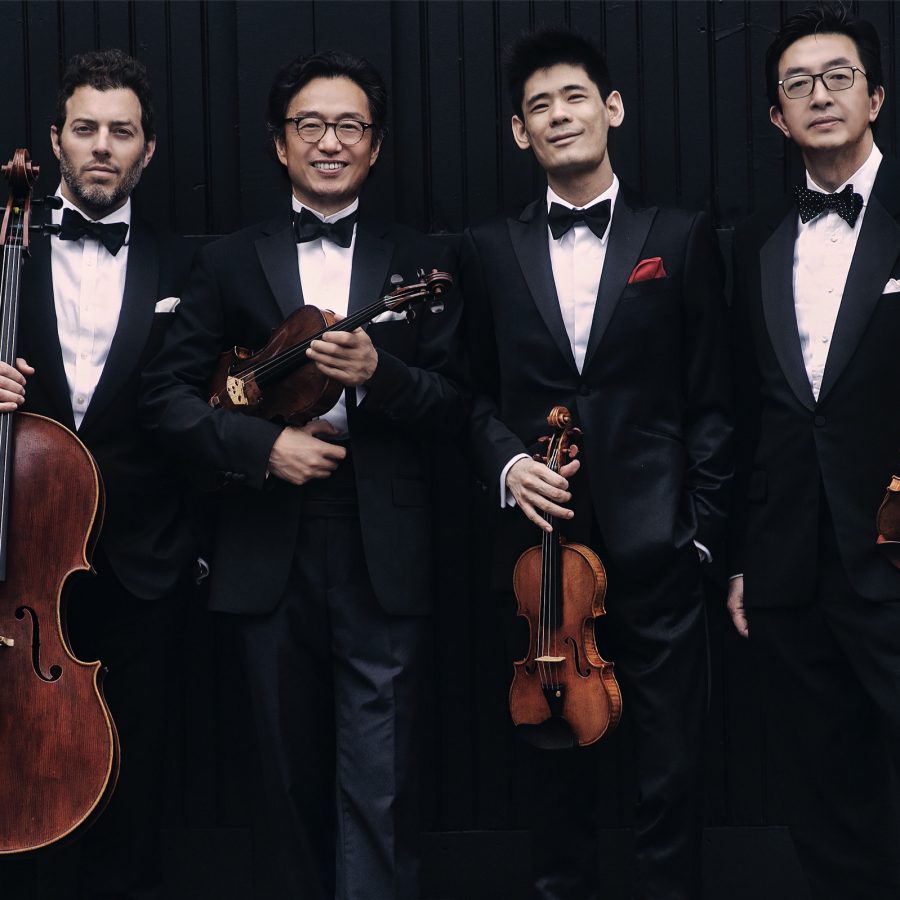 The Shanghai Quartet, who’ll perform in Guangzhou, pose for a picture with their respective string instruments.