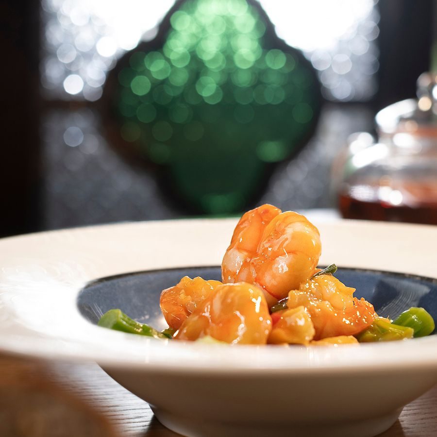 Wok-fried prawns with spring onions and bird's eye chilli