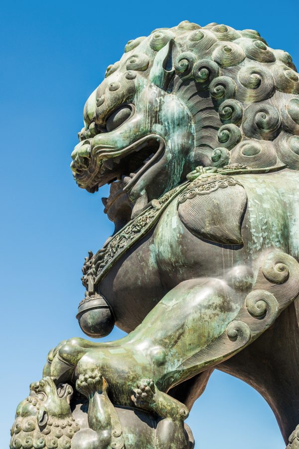 Bronze lion statue on display at the Forbidden City, Beijing. 