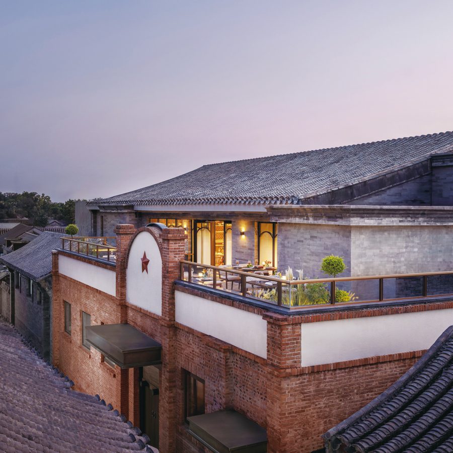 The exterior of the Mandarin Oriental Qianmen at dusk, taken from roof opposite.