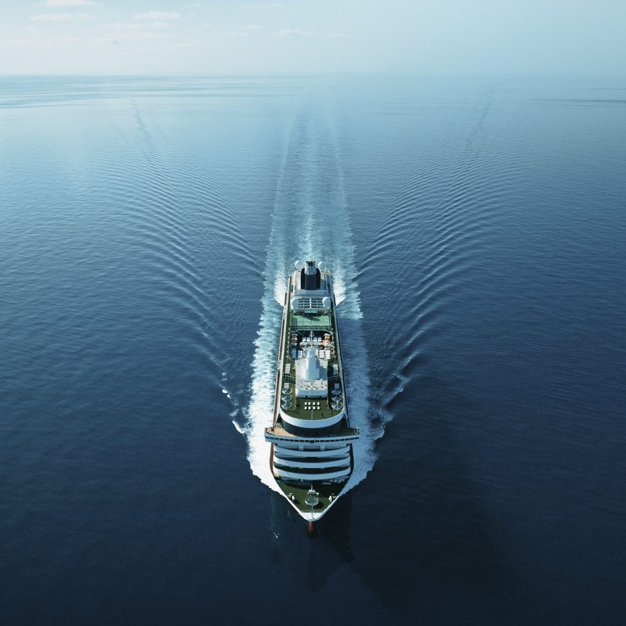 A large cruise ship cuts through a vast body of water, creating symmetrical waves.