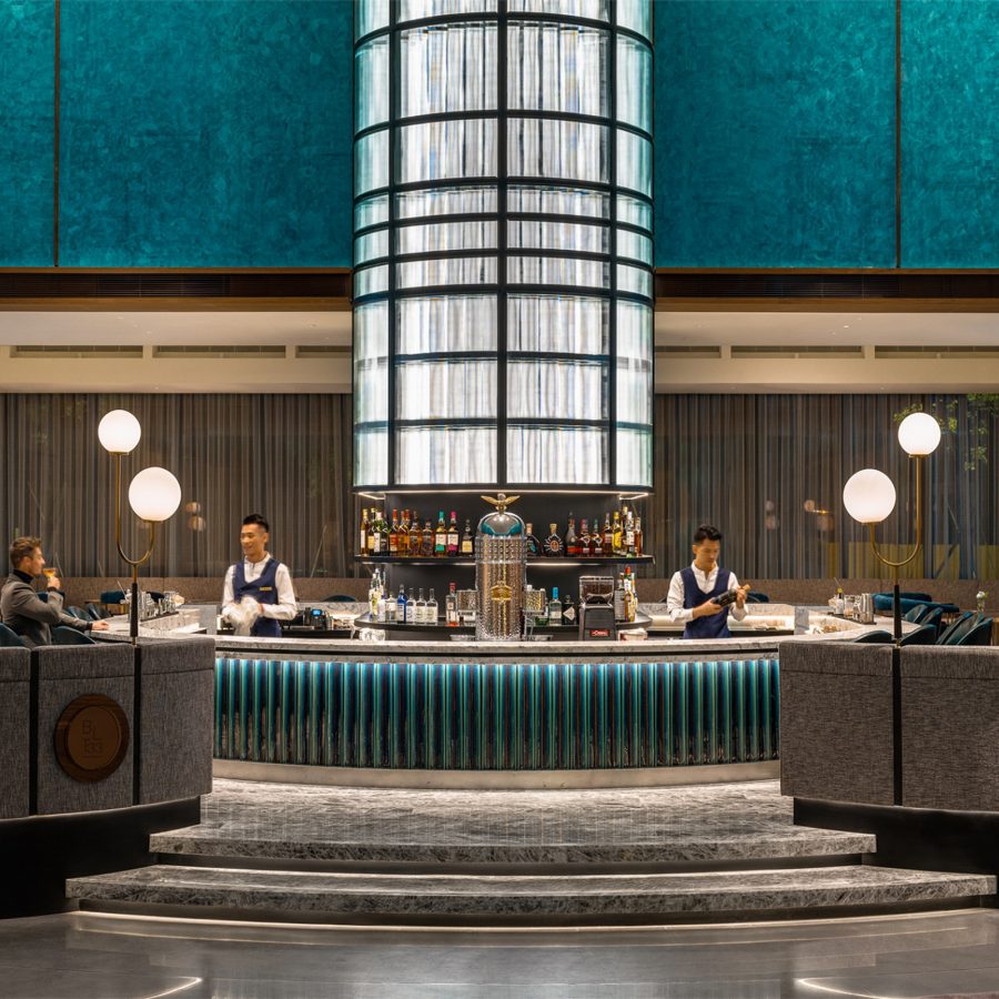 The lobby of InterContinental Kaohsiung is decorated with deep teal furnishings.