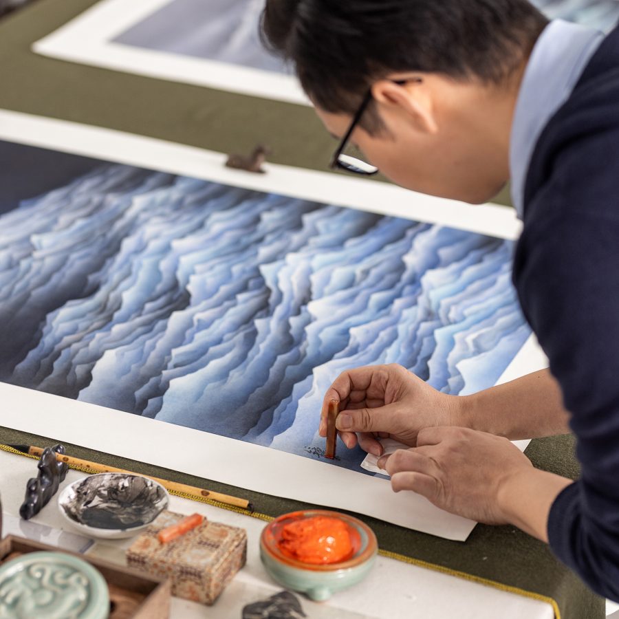 Close up of Chan Keng Tin's hands as he works on a piece for his “Formless” series 