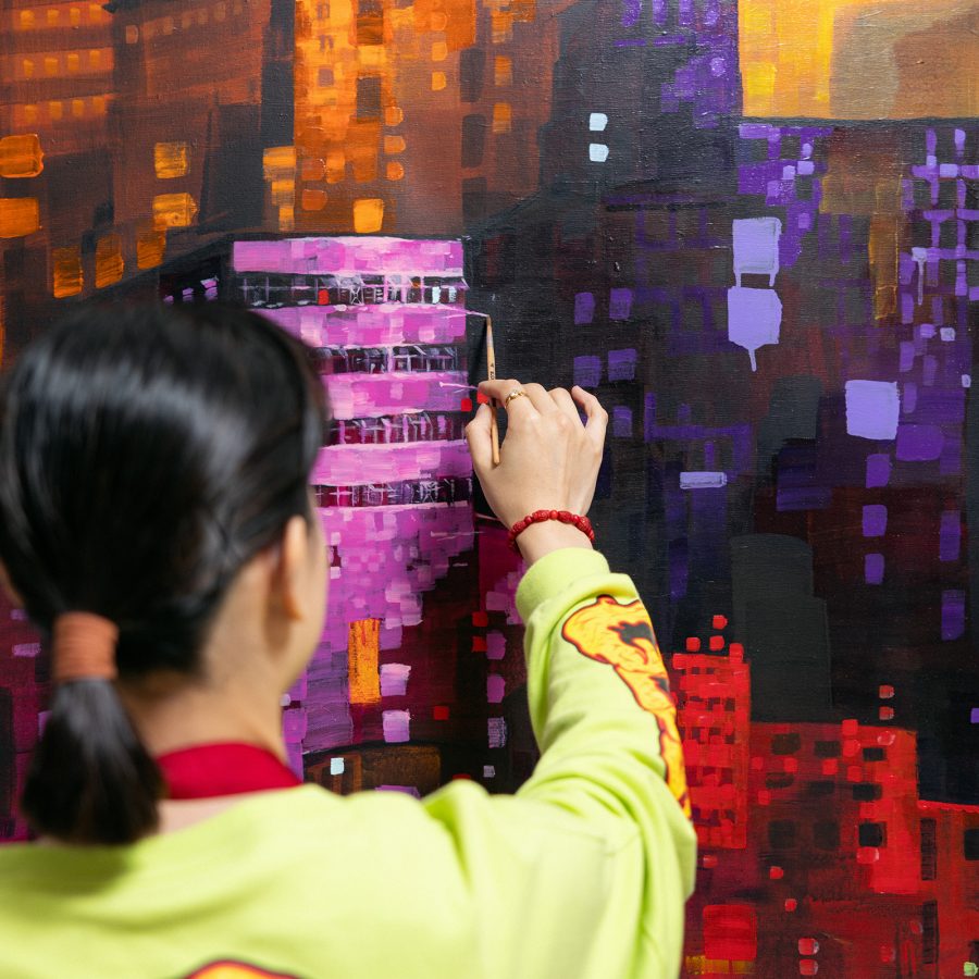 Elaine Chiu painting from behind