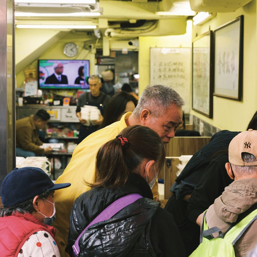 Ming Gor and his staff distribute meal boxes at Pei Ho Counterparts. 