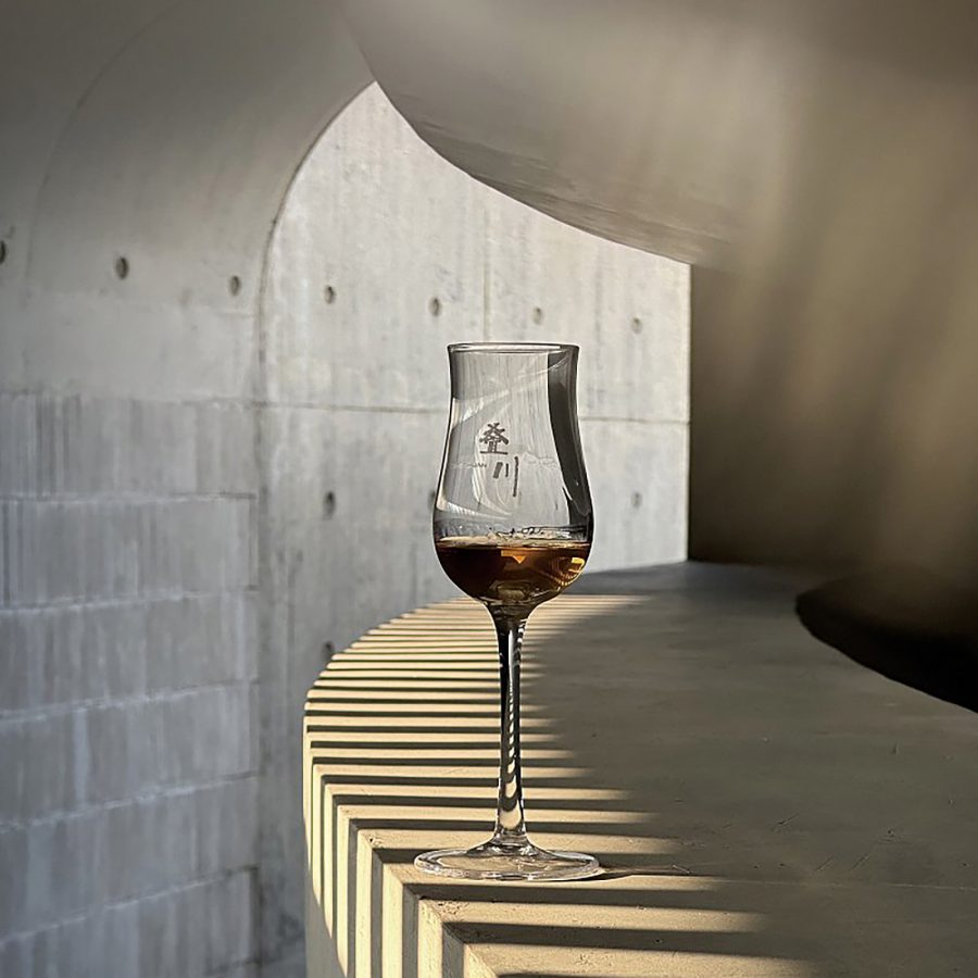 A glass of The Chuan whisky.