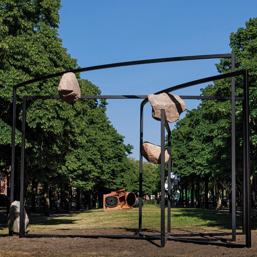 A street art installation of rocks and steel connected together in a park in Amsterdam, Netherlands 