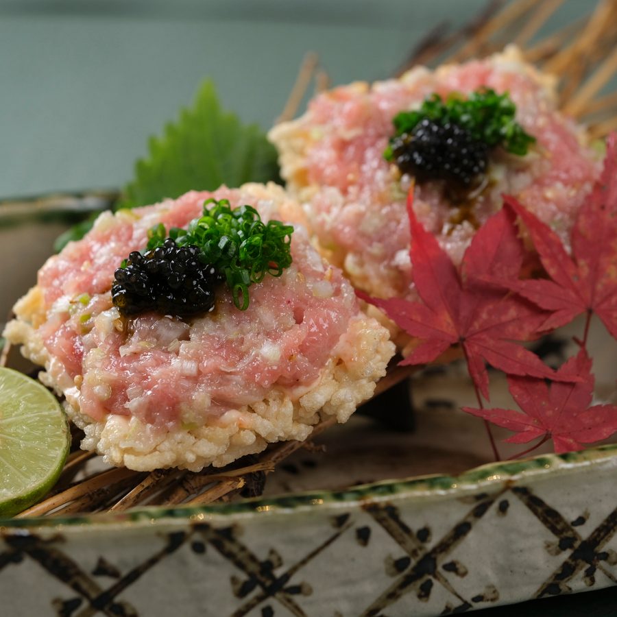 A closeup of a crispy tuna belly with caviar served at Saburo Japanese Yakiniku, Hong Kong