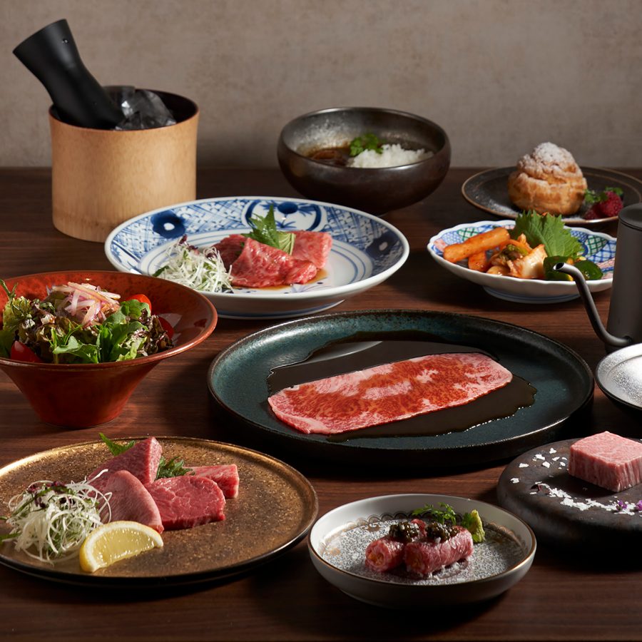 A spread of various beef slices and dishes served at Yakiniku Ushio, Hong Kong