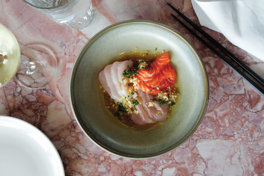 Top-down shot of a dish with three types of raw fish at Bar Miette in Brisbane.